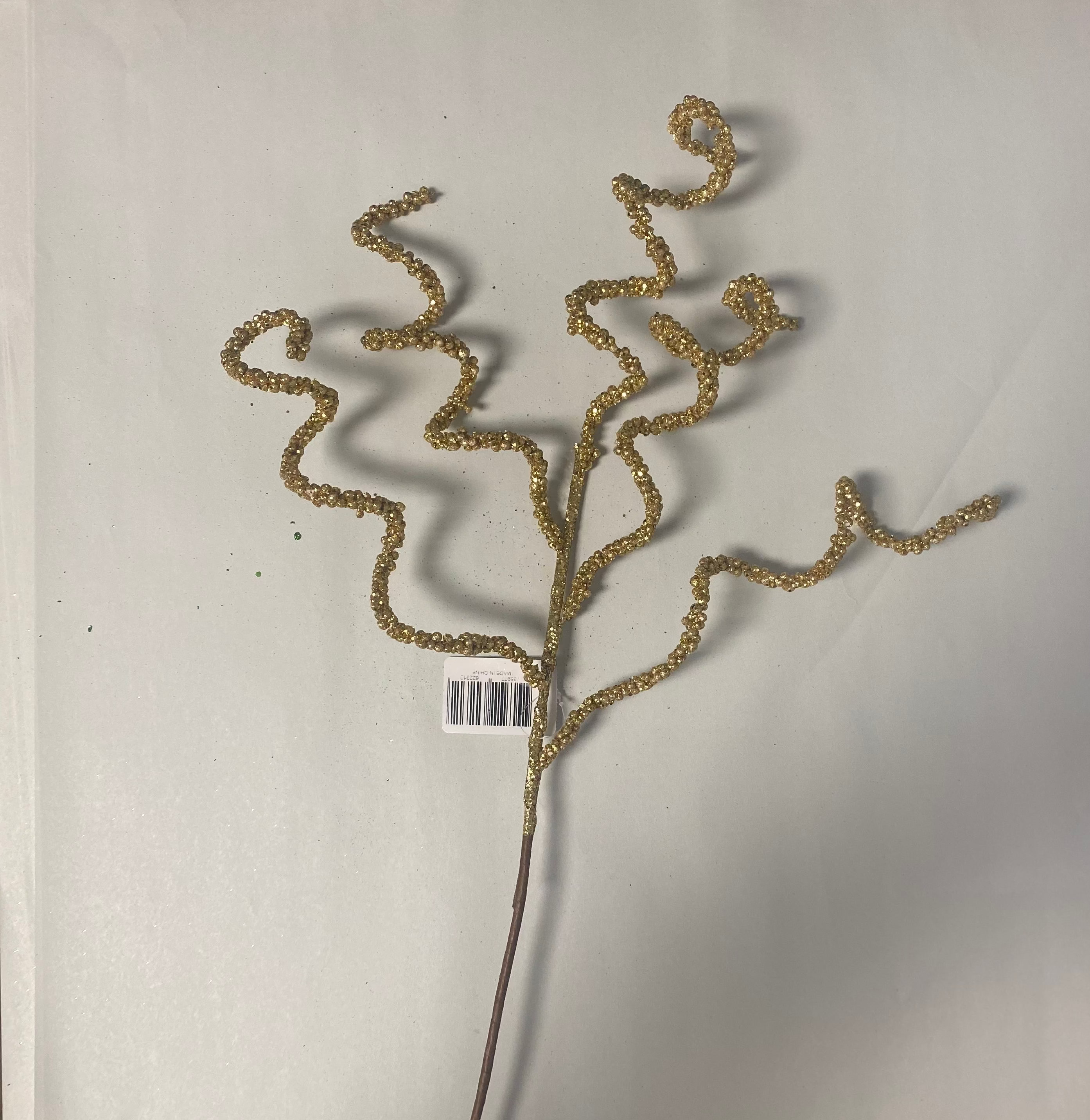 Gold swirly bead spray