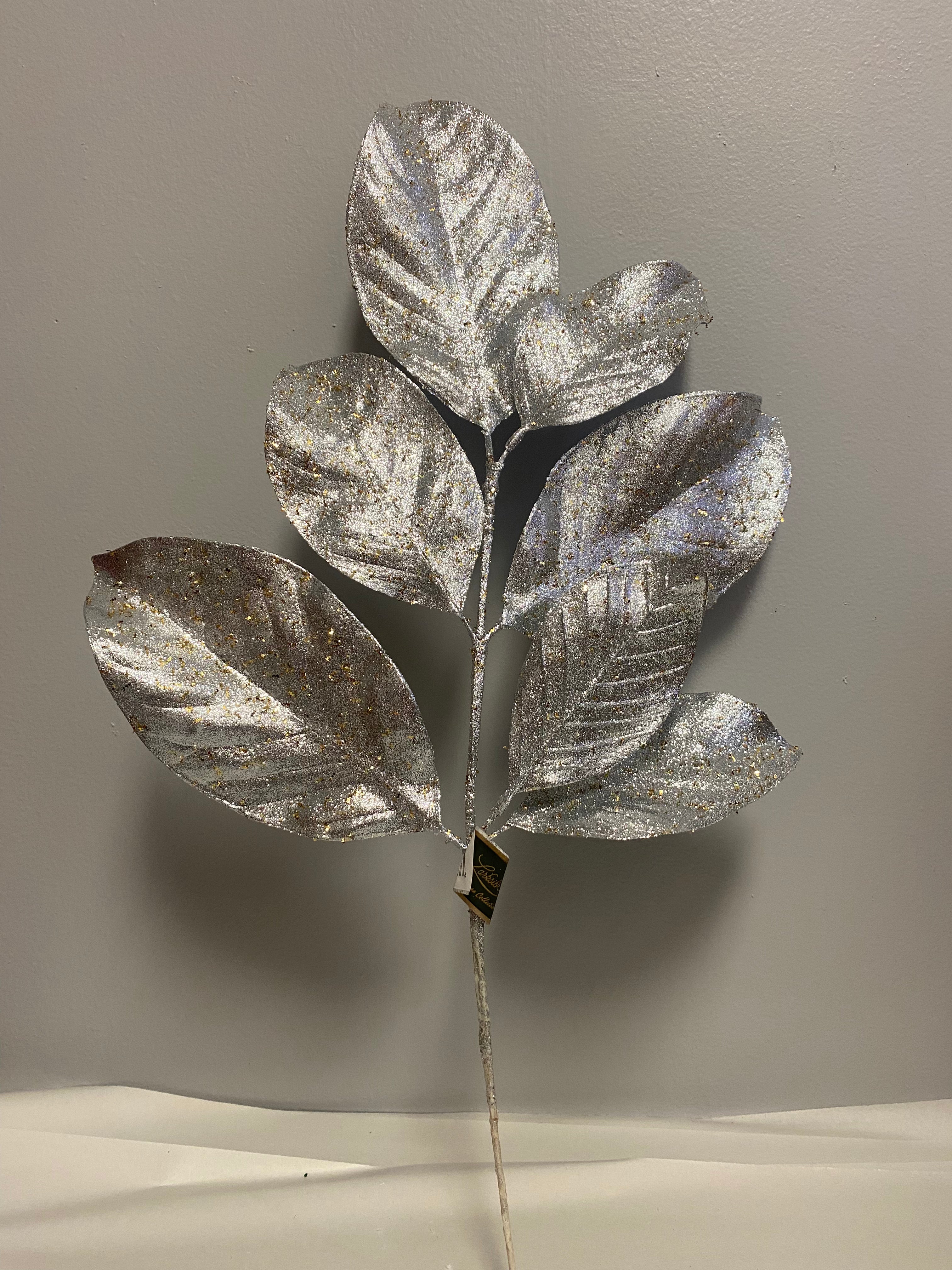23.5” Silver magnolia leaf spray with gold glitter flecks
