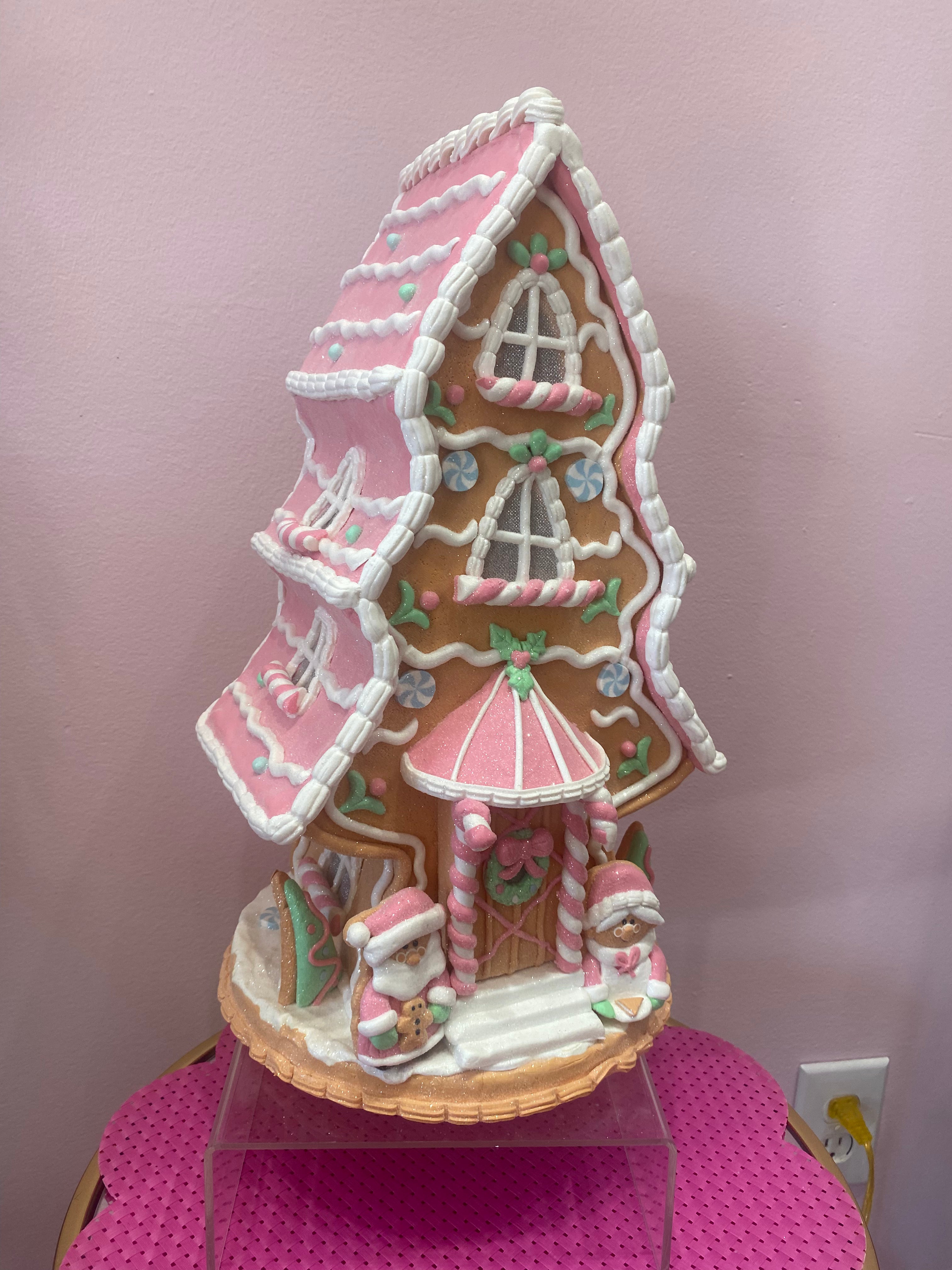 Light up Gingerbread house with pink roof & pink Santas and candy canes